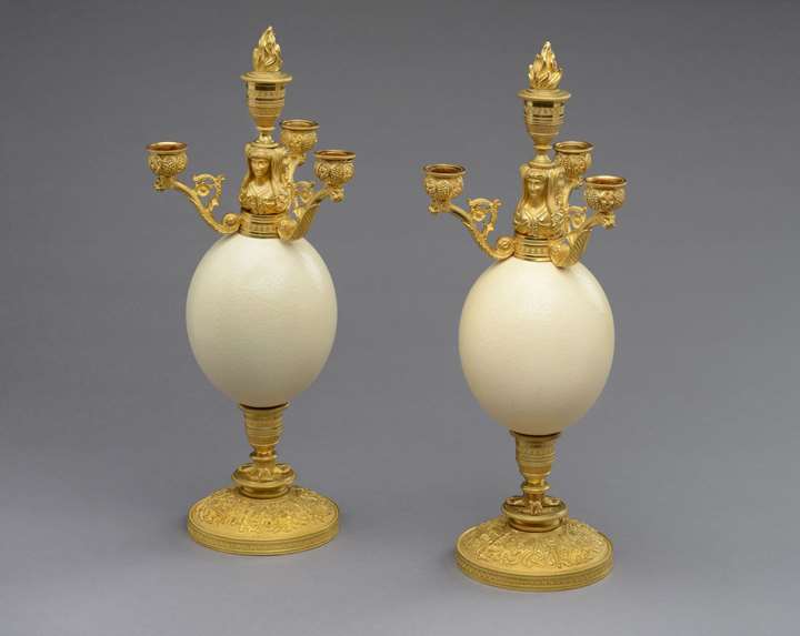 A pair of restauration ostrich eggs ormolu mounted four branches candelabra